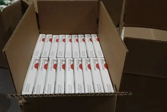 A box of 1 0 boxes of the same brand lipstick.